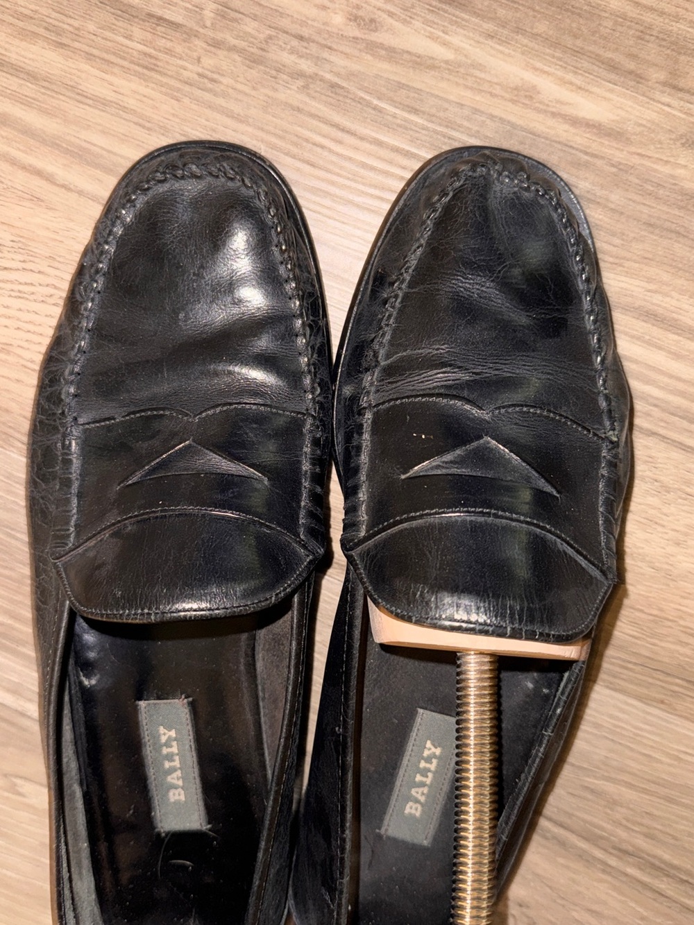 Bally Black Leather Penny Loafers with Moc Toe Stitching